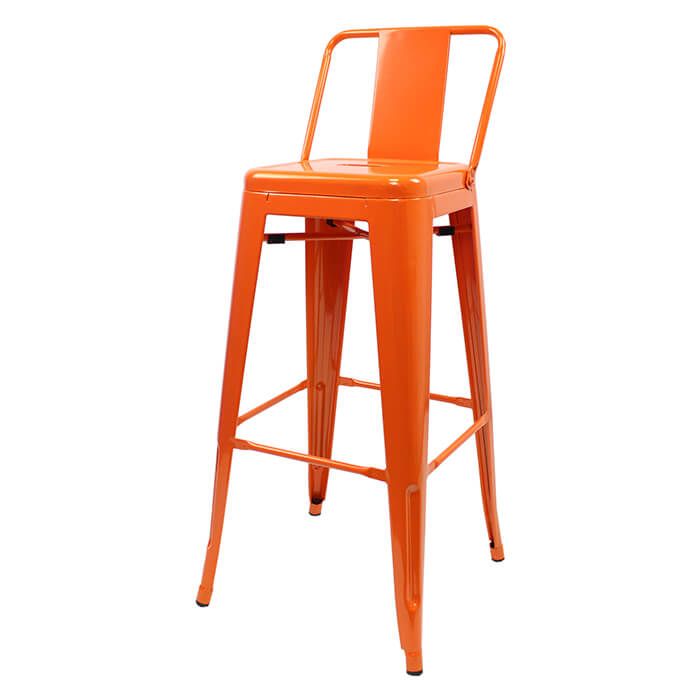 Profile view of orange Tolix low back stool
