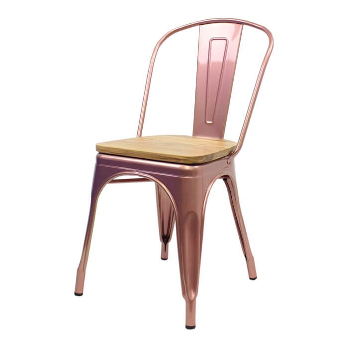 Profile view of rose gold Tolix chair with oak seat