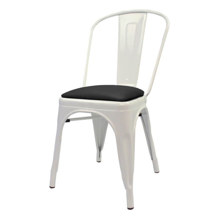 Profile view of white Tolix chair with dome seat