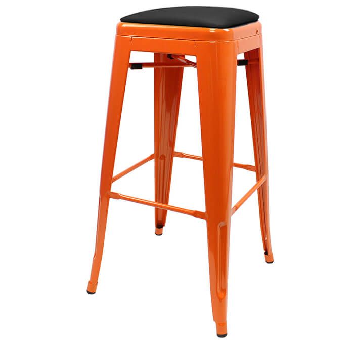 Profile view of orange Tolix bar stool with dome seat
