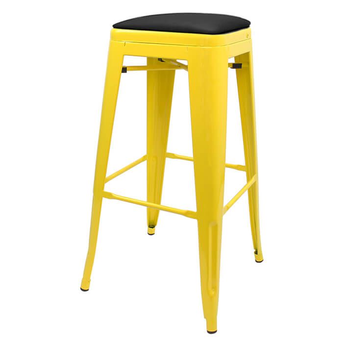 Profile view of yellow Tolix bar stool with dome seat