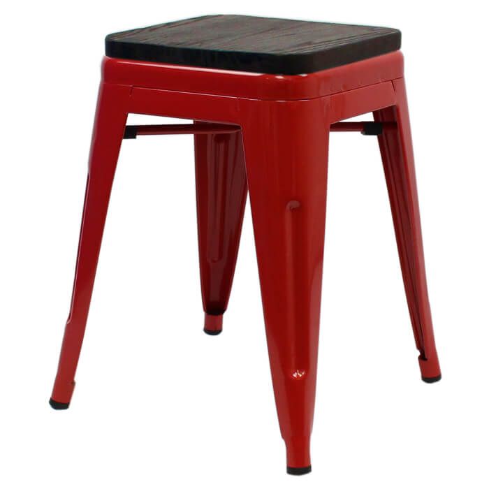 Profile view of red Tolix low stool with walnut seat