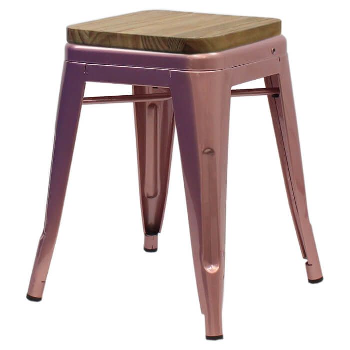 Profile view of rose gold Tolix low stool with oak seat