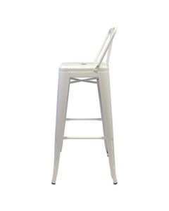 Profile view of white Tolix low back stool