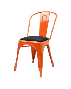 Profile view of orange Tolix chair with dome seat