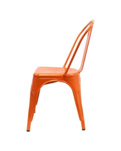 Profile view of orange Tolix side chair