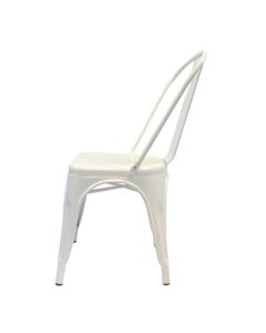 Profile view of white Tolix side chair