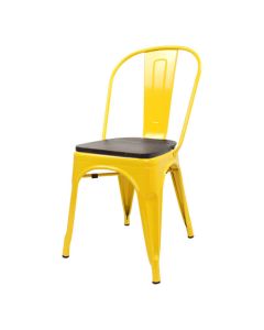 Profile view of yellow Tolix chair with walnut seat