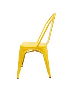 Profile view of yellow Tolix side chair