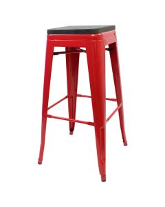 Profile view of red metal Tolix low stool with walnut seat