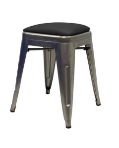 Profile view of industrial grey Tolix low stool with dome seat