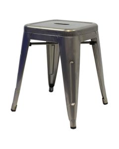 Profile view of industrial grey Tolix low stool
