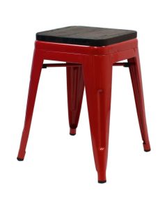 Profile view of red Tolix low stool with walnut seat