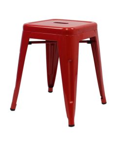 Profile view of red Tolix low stool