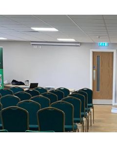 Profile view of green steel diamond stacking chair